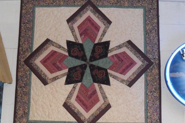 Willow Creek Cafe & Store - "Log Cabin in the Round: quilts on walls inside by owner Bev Vickery