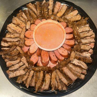 Cooked Beef Fajita and Sausage Platter.