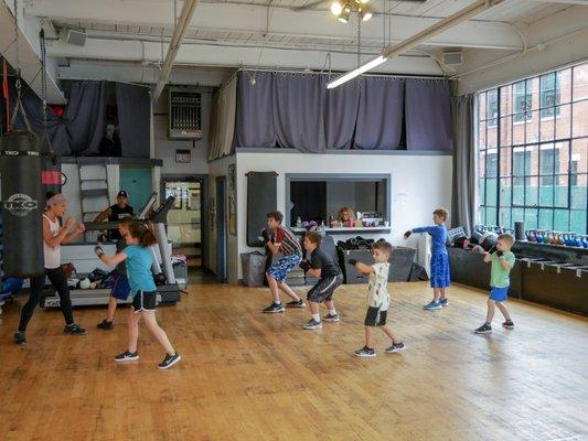 Trainer Karen teaching out Boxfit Kids class