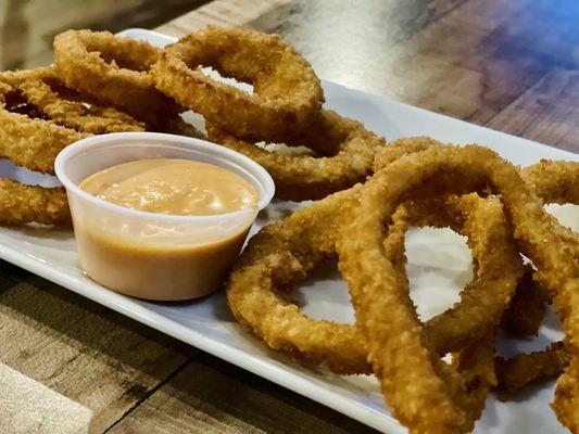 Onion rings and buffalo dipping sauce