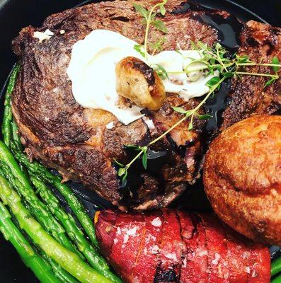 Prime Ribeye Steak with Stilton, aged balsamic, hassle back potatoes & fresh baked popovers