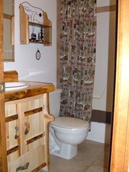 Full bathroom with tile floors, a shower & bath.