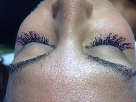 Highlighted purple eyelash extension.