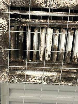 Air conditioning registers at Public storage, covered in black mold