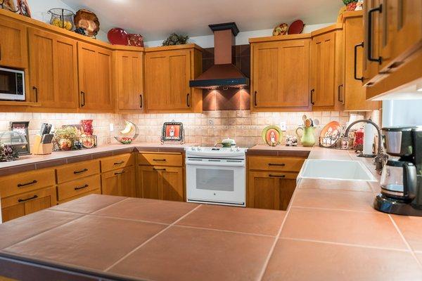 This kitchen design by Lawson Construction makes you feel the warmth of home cooking just looking at it.