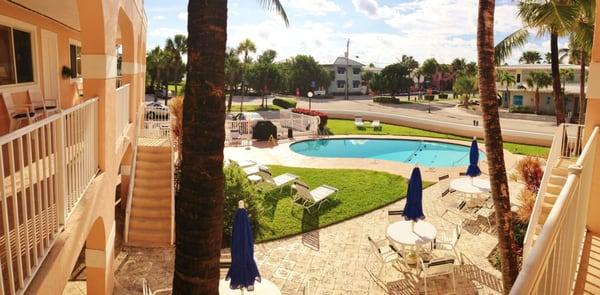 upstairs view to the pool and garden