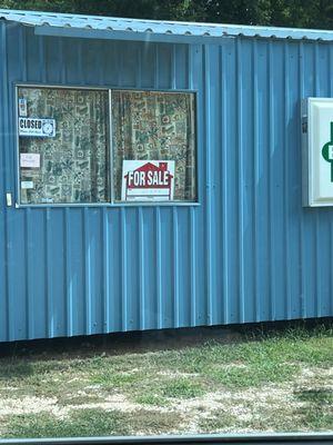 Closed and for sale sign.