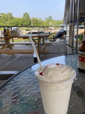 Piña colada overlooking marina.