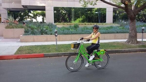 Beverly Hills girl demonstrating the Beverly Hills green bike share.