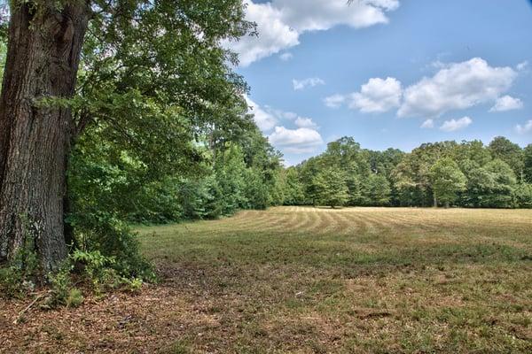 Location, location, location! 9.5 acres with a mix of grass and hardwoods, just 2 miles from Madison's Town Park! $175,000.