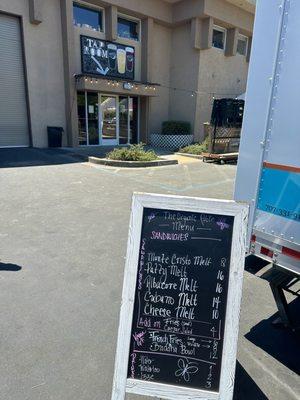 Menu in front of Moonlight Brewing Co