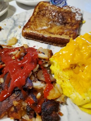 Scrambled eggs with cheese and French toast.