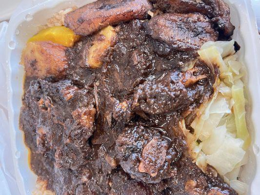 Oxtails, cabbage, rice and peas