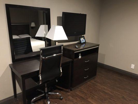 Office chair, desk, mirror, TV and TV cabinet