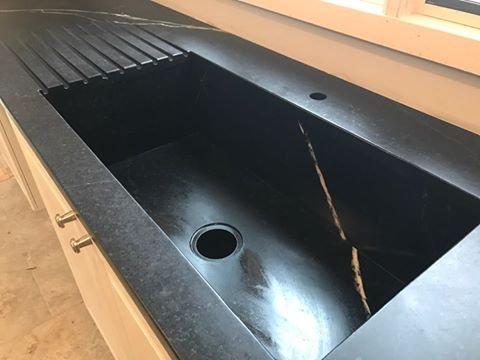 Custom Alberene soapstone sink and counter tops with a finger drain side board