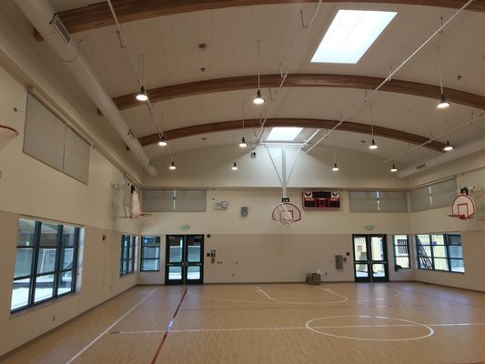 Motorized roller shades installed by Drapery Concepts at Clerestory windows