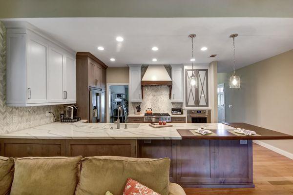 Kitchen remodel with painted white finishes and gray stained cabinetry