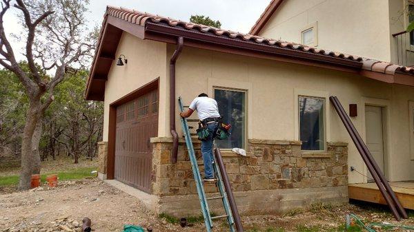 6" K-Gutter and round downspouts pair well with Spanish-Style tile roofs