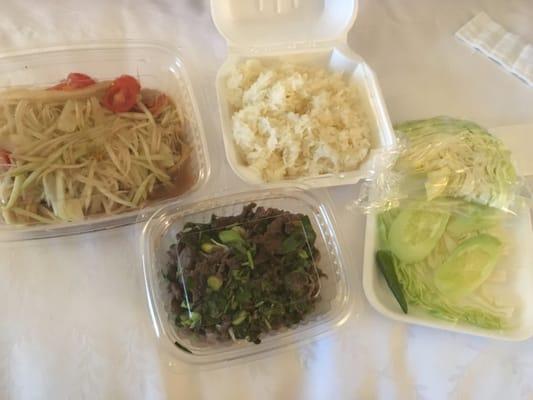 Papaya salad, sticky rice, and beef laab (cost less then $12)