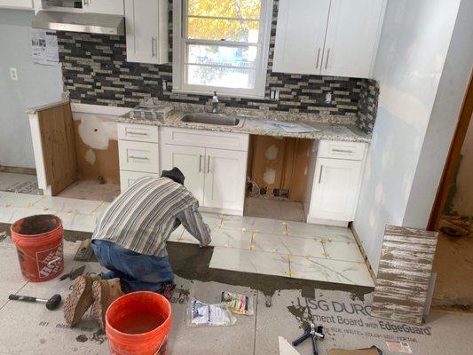 Installing new kitchens and tiles in the floor