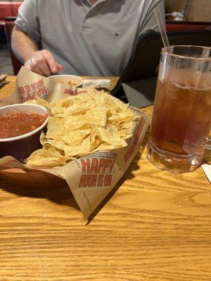 Chips and salsa with a nice iced tea