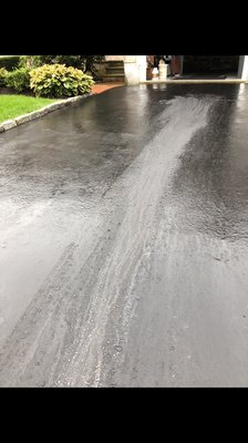 Once the driveway dried the oil stayed and also cracked due to the oil cleaner they used