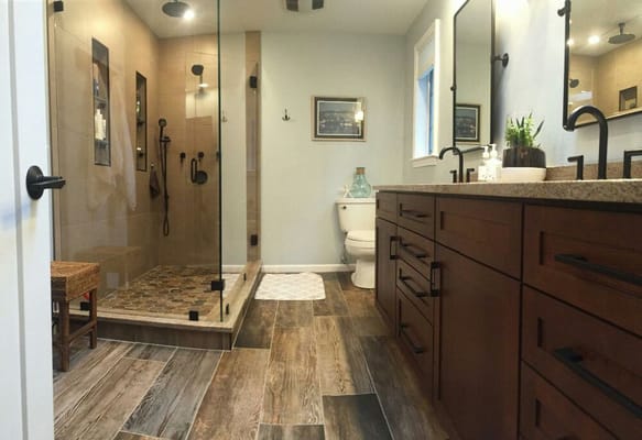 Kitchen counter top center bath remodel and custom glass shower unit . Great design and finished product .