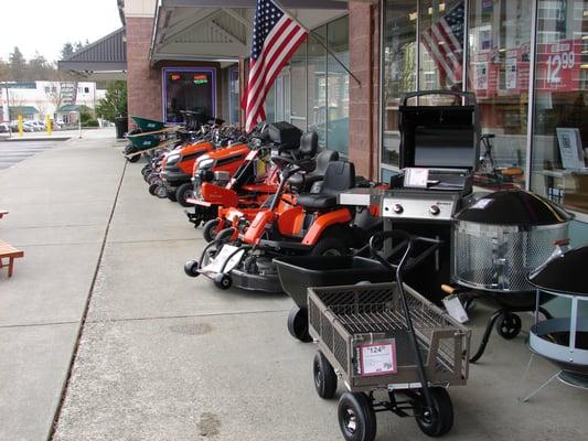 Our front walk filled with new Weber Grills and Husqvarna Tractors rready for your patio or yard