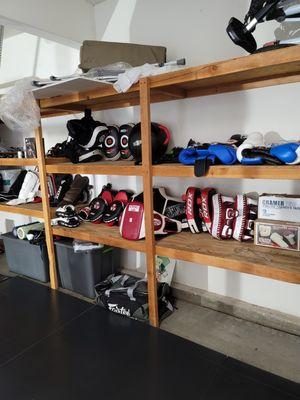 Mitts, pads, gloves, shin guards, coaching equipment and extras for clients to use