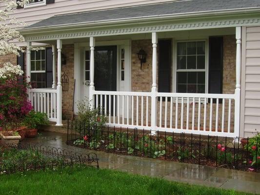 New, low maintenance, white vinyl front porch posts and railings adds a nice inviting touch to this Gaithersburg Colonial