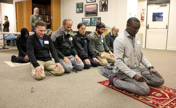 Muslims pray during AAi compassion event uniting Jews, Christians and Muslims to serve neighbors in need (Carmel, Calif.)