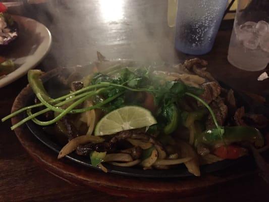 Beef fajitas on sizzling plate