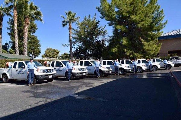 Yuba City Pest Control technicians with their trucks.