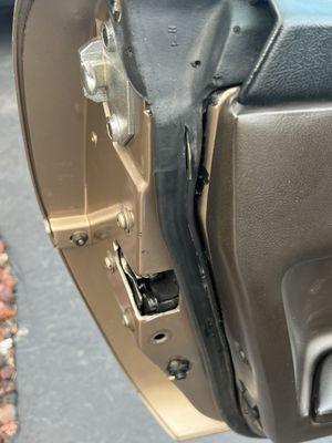 Metal sticking out of newly installed weather stripping, door panel not seated correctly, and missing rubber boot