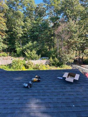 Charcoal blue shingle roof installation