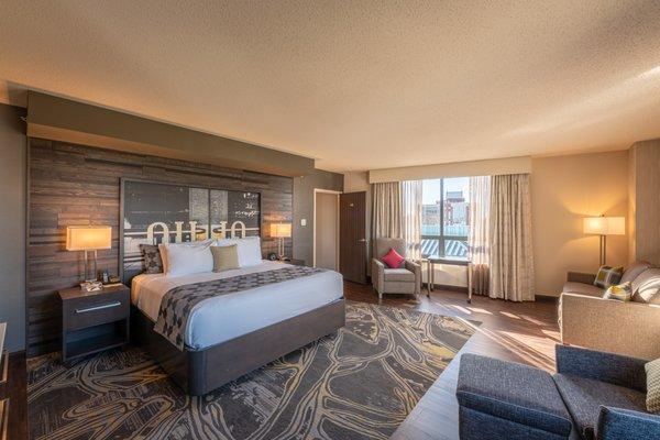 Our newly renovated Stadium View Suite, which includes a pull-out sleeper sofa, kitchenette, and conference table.