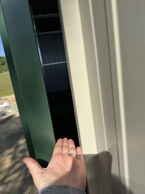 Open gap between breezeway doors and barn.