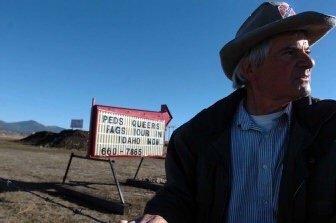 What kind of landscape supplies are sold using a marquee sign with obscene statements?