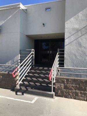 The front entrance of the building from
the upper lot.  There are six small steps.