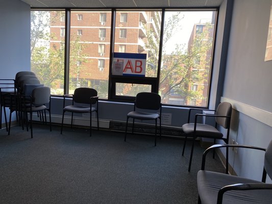 Socially distanced chairs to sit while waiting