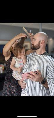 Baby first haircut at the barber shop