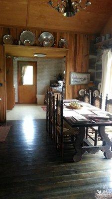 Inside cabin: Coffee pot, sink,  microwave,  small fridge in the kitchen complete with plates, cups bowls & flatware.