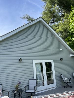 Siding replacement in Danvers MA.  Replaced wood clapboard siding with vinyl siding.  New gutters.