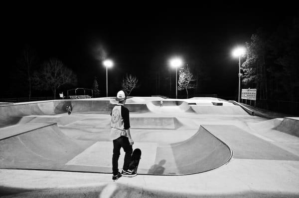 Treaty skatepark at night with its lights on.