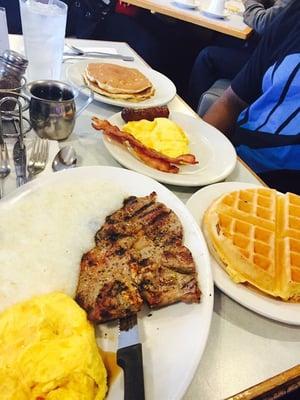 T-bone, grits, eggs, waffle. - all one meal.