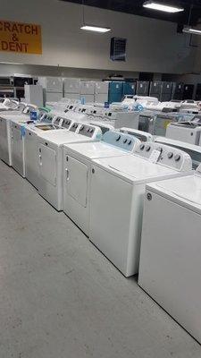 Top load washers and dryers