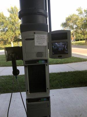 This is the station for customers. You can use the phone if you want. You send your money and pick up your prescriptions in a tube.