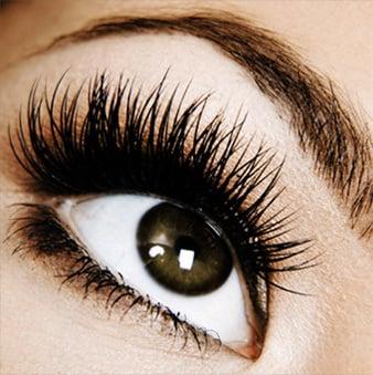 healthy eyelash and eyebrow extensions with medical grade glue and enhancing serums for natural growth