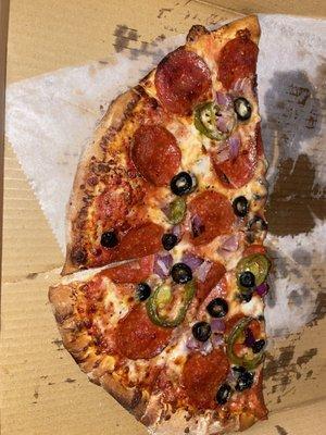 NY style pizza with pepperoni, jalapeños, olives n onions...