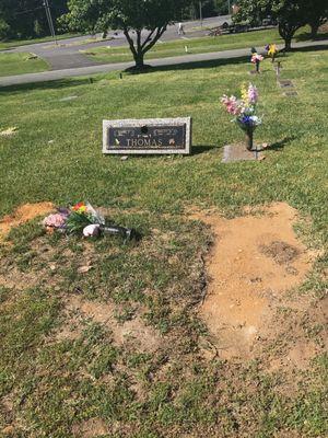 Memorial Day! Side view... of my parents headstone still resting on my Granddads grave! Grass mowed and nothing is under the headstone.